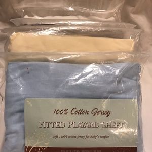 4 sets of fitted playard mattress sheets.